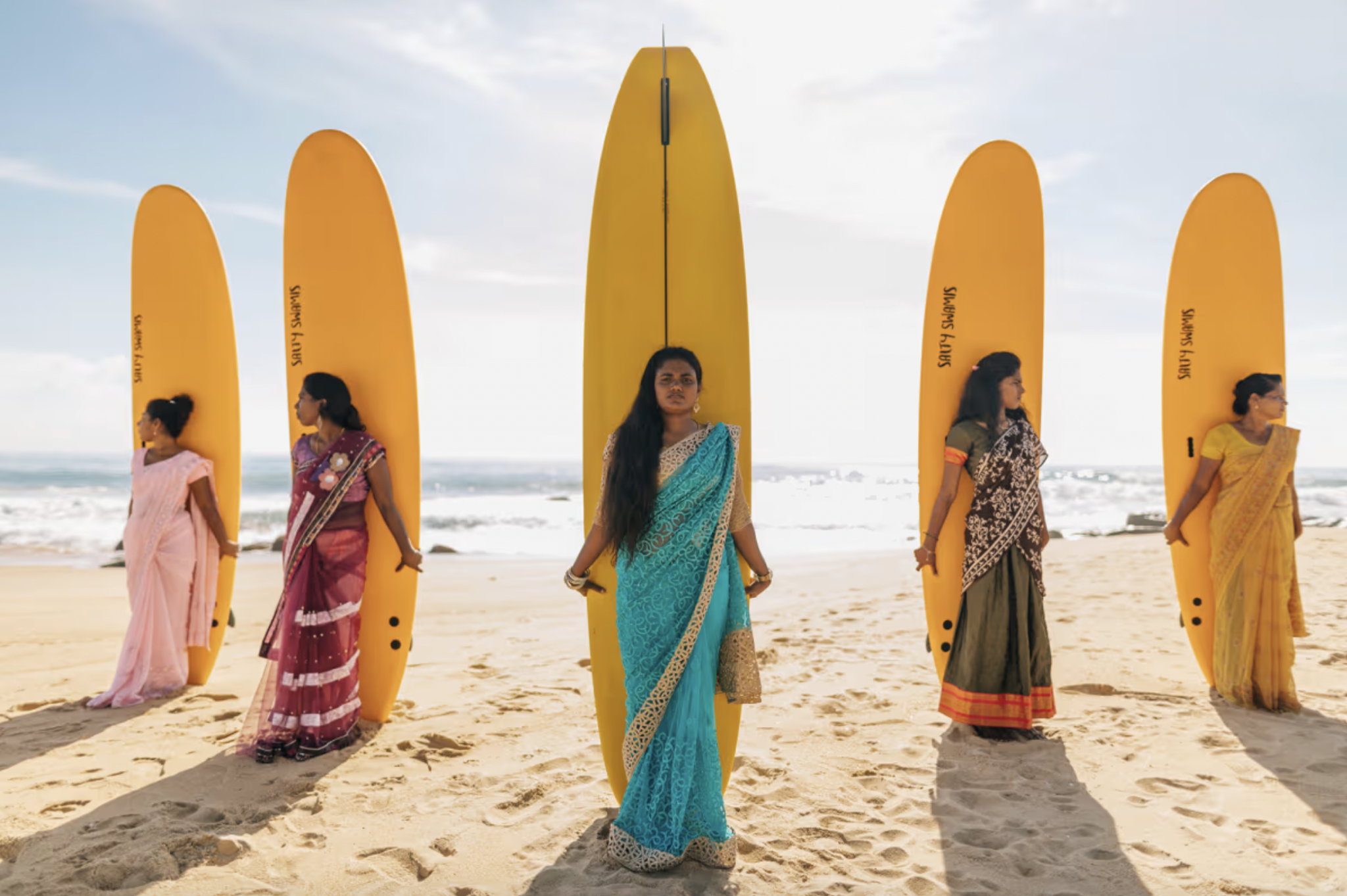Shamali Sanjaya (centre) with members of the Arugam Bay Girls Surf Club. Photograph by Max Gifted.